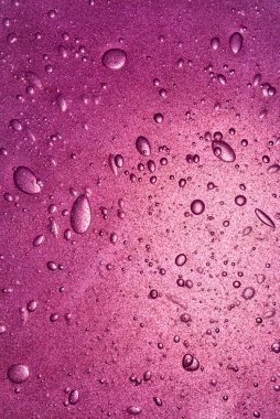 Bubbles in purple liquid gel, cosmetic product, backdrop.