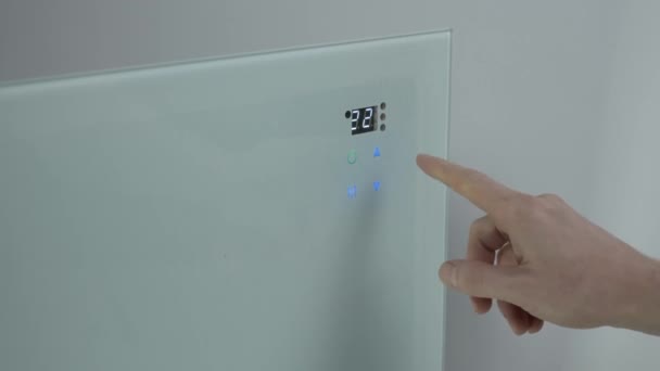 Male Finger Presses Touch Button Wall Heater Adjusts Temperature Room — Stockvideo