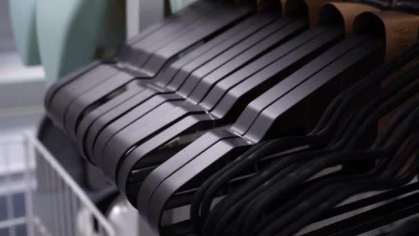 Empty Black Plastic Hangers Clothes Counter Store Sale Trempels Sale — Wideo stockowe