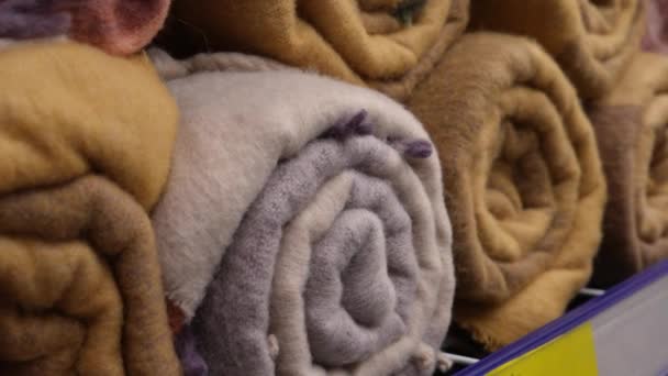 New Multi Colored Woolen Plaids Twisted Rolls Store Shelf Close — Video
