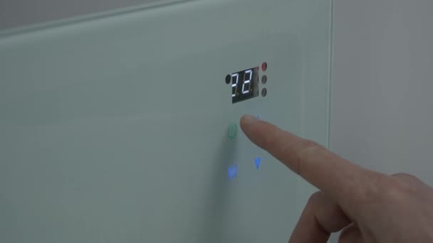 Male Finger Presses Touch Button Wall Heater Adjusts Temperature Room — Vídeos de Stock