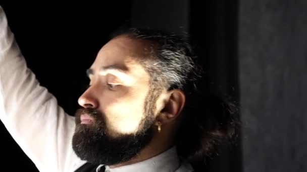 Dark Skinned Man Beard Shirt Vest Draws Brush Intently Twilight — Stock Video