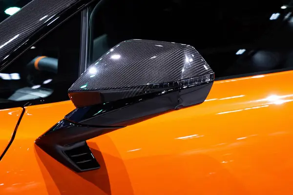 A car side mirror or door mirror is built on the car's exterior to help the driver see areas behind and to the sides of the vehicle.
