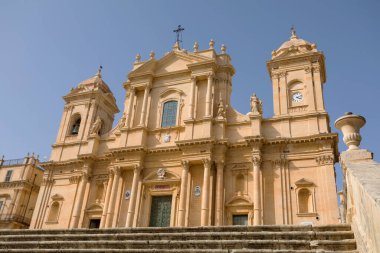 NOTO, SICILY - APRIL 23, 2019: Tourists visit the Noto cathedral and the Piazza del Duomo, Sicily 