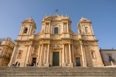 NOTO, SICILY - APRIL 23, 2019:Tourists visit the Noto cathedral and the Piazza del Duomo, Sicily 