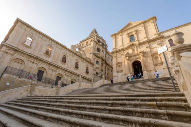NOTO, SICILY - APRIL 23, 2019: Tourists visit the Noto cathedral and the Piazza del Duomo, Sicily 