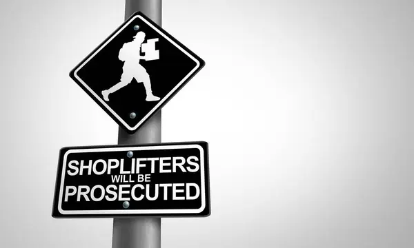 stock image Shoplifting and Shoplifters as Retail crime theft problem robbing to shoplift stores as a criminal business concept of a shoplifter stealing merchandise from a retailer as a thief committing larceny and prosecution.