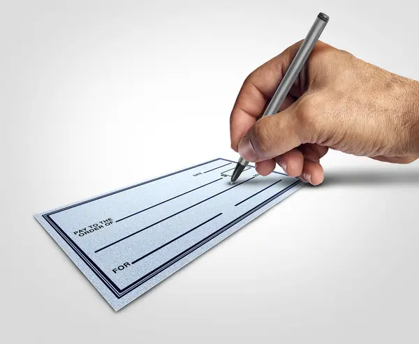 stock image Blank check signing as a person with a pen using it to sign a cheque representing unrestricted financial limits and due diligence as an investing and trust banking corporate concept.