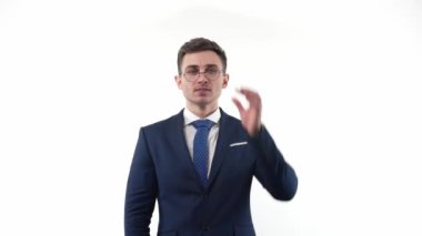 Confident young male businessman in slow motion, pointing Relax, everything is fine ok shows good gestures and smiles approves products. High quality FullHD footage