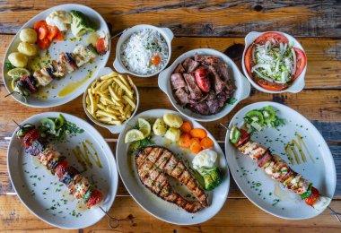 Mixed grilled meat on plate with vegetables salad rice potato cusida. Portuguese traditional food. High quality photo