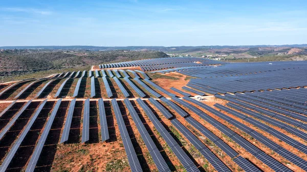 The stations solar panels cover the fields of the Portuguese hills to generate clean, ecological electrical energy. High quality photo