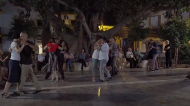 On the streets of Seville in Spain, tango dance lessons are held in the park for all tourists and residents of Spain. Valencia Spain 16 September 2022. High quality 4k footage