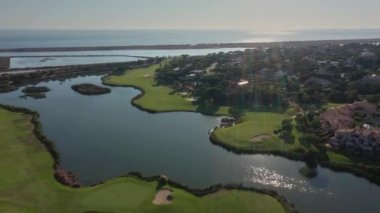 Amazing aerial views of Quinta de Lago village with lake and golf courses. High quality 4k footage