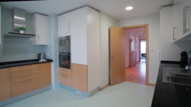 Modern equipped kitchen with all amenities in the apartment. Movement to the side. High quality 4k footage
