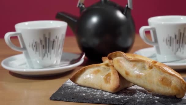 Appetizing Fresh Empanadas Stone Tray Close Slow Motion Tea Set — Vídeo de Stock