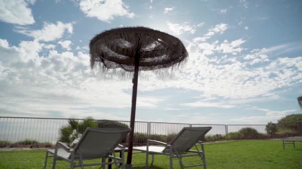Sun Loungers Straw Umbrella Grass Front Sea Beach Rays Sun — Stock Video