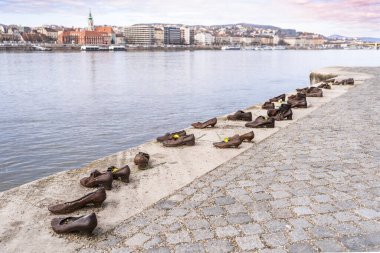 The Shoes on the Danube Bank is a memorial to honour the Jews who were massacred in Budapest during the Second World War clipart