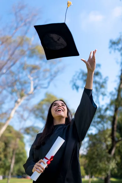 Happy Caucasian Graduated Girl Black Gown Throwing Mortarboard Sky — 스톡 사진