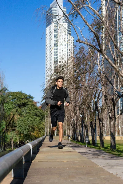 stock image Fitness athlete runner jogging on park sidewalk. Copy space