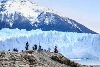 Tourists exploring the stunning Perito Moreno Glacier clipart