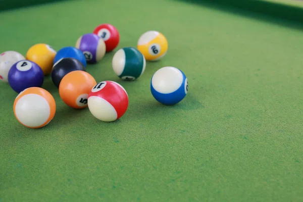 stock image Billiard balls on a green billiard table.