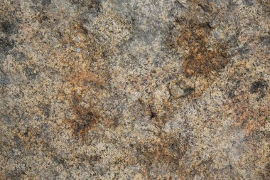 Arka plan için kırmızı kahverengi kaya doğal dokusu. Çatlak dağ yüzeyini kapatın..