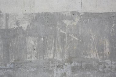 Yüzey dokusu arka planında çizikler olan soyut beton duvar.