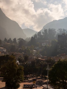 Bogota, Colombia - Dec, 2022:  Parque de Los Periodistas -Journalists' Park in Bogota and view on the Monserrate Hill during the foggy morning. La Candelaria district of Bogota, South America