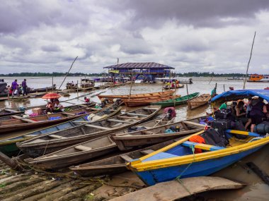 Tabatinga, Brazil - Mar, 2018: A huge traffic of different types of boats in the port of Amazon river. Low water season. Amazonia. South America.