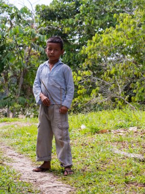 San Pedro, Brazil - Sep 2017: Portrait of a boy with bow with an arrow-  local inhabitant of the Amazon rain forest.  Amazonia. Latin America