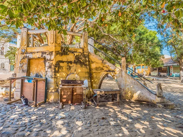 stock image Goree, Senegal- February 2, 2019: Stairway leading to a ruined-concrete made-open air kiosk on the main square of Goree island. Gore. Dakar, Senegal Africa. Ille de Goree.