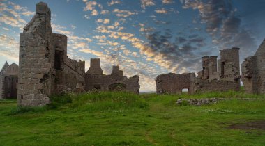 Slains Castle, also known as New Slains Castle to distinguish it from Old Slains Castle, is a ruined castle in Aberdeenshire, Scotland. It lies on a rocky coast, around a kilometer east of Cruden Bay and oversees the North Sea clipart