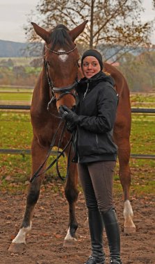 Shooting with brown Rhineland gelding and her rider 