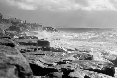 costal rocks and  ocean  in black and white clipart