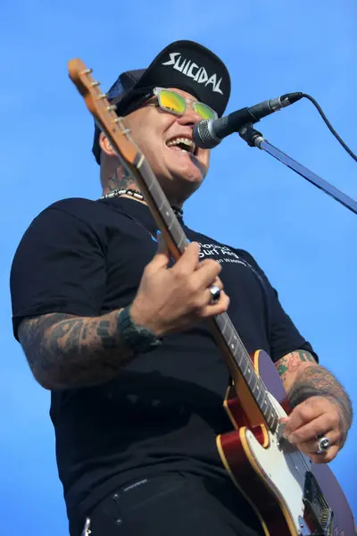 stock image Flavio Cianciarulo, Sr. Flavio, performing with his band on International Surfing Day event. Mar del Plata. Buenos Aires. Argentina