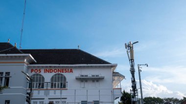 Yogyakarta, Indonesia - January 14, 2023: The exterior of the Indonesian post office landscape photo, a heritage building on Yogyakarta's Kilometer 0 near Malioboro street.