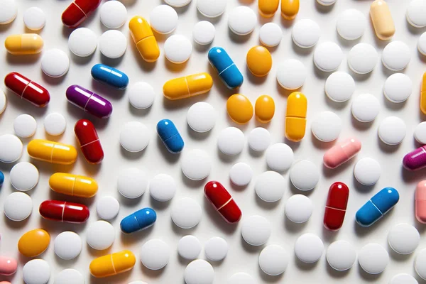 stock image Various pills on a white background, overhead shot