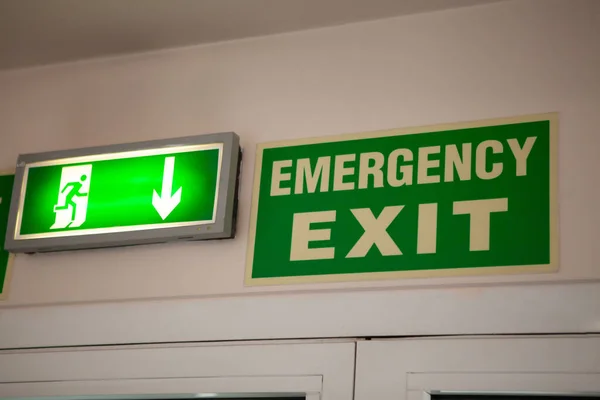 Emergency exit sign over doors.