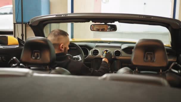 Portrait Young Bearded Male Car Detailing Worker Sitting Modern Vehicle — Stock videók