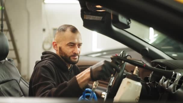Handsome Male Cleaner Black Uniform Protective Gloves Removing Dirt Car — Vídeos de Stock