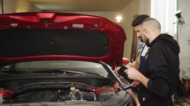 Car Service Station Two Young Bearded Attractive Mechanics Men Standing — Video