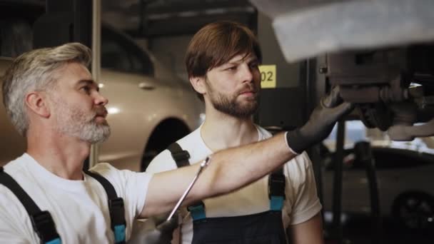 Two Car Mechanic Father Son Diagnosing Vehicle Auto Service Family — Stock Video