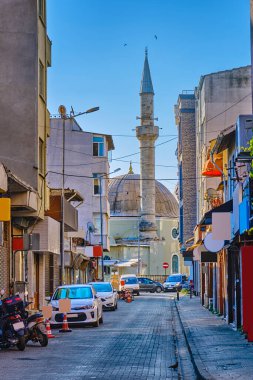 Chanakkale, Turkey, Colorful streets with old beautiful houses and souvenir shops and restaurants. View of the mosque clipart