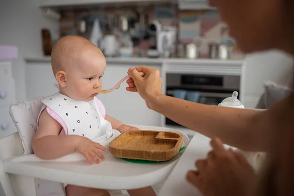 first feeding of the child, the child refuses to eat. High quality photo
