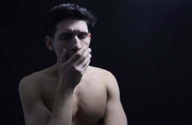 Close up Face of a Pensive Handsome Young Man with Tears in His Eyes, Worried or Sad.