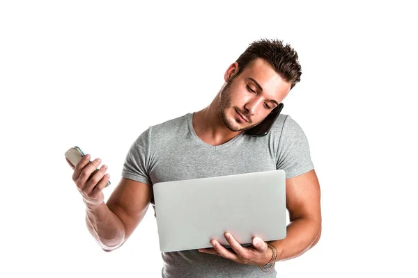 Joven Hombre Guapo Sosteniendo Usando Demasiados Dispositivos Mismo Tiempo Abrumado —  Fotos de Stock