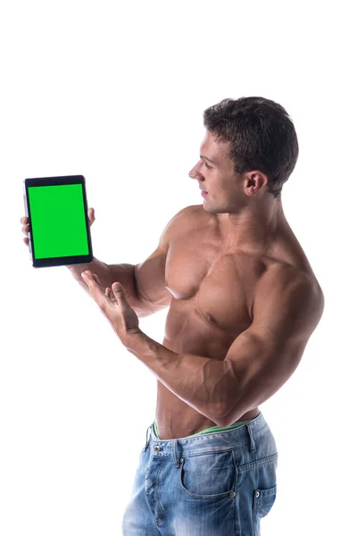 Sexy Musculoso Sin Camisa Joven Sosteniendo Una Tableta Blanco Mientras —  Fotos de Stock