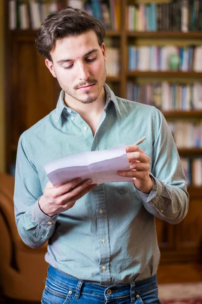 Young Man Shirt Holding Pen Papers Looking Them Writing — Stock Photo, Image