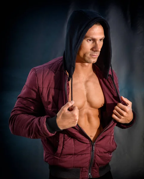 Muscleman Opening His Hoodie Sweater Revealing Muscular Torso Dark Background — Stock Photo, Image