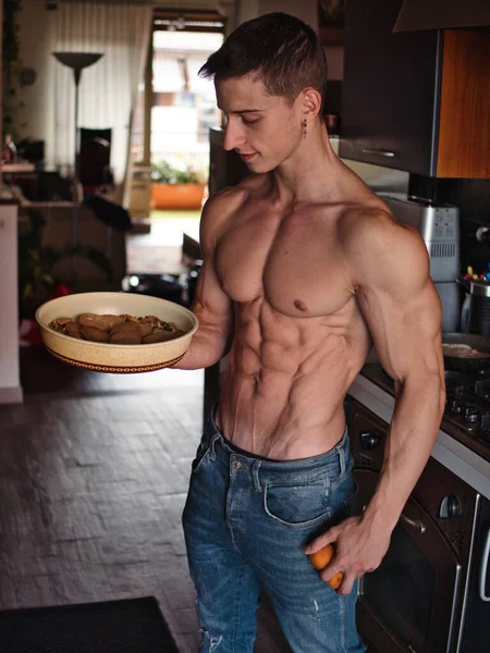 Muscular Shirtless Young Man Deciding Healthy Fruit Unhealthy Cookies Home — Stock Photo, Image